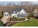 Aerial view of home with a well-manicured lawn and an inviting front porch at 1412 Wynncrest Ct, Raleigh, NC 27603