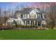 Charming two-story home with a beautifully landscaped yard and welcoming front porch at 1412 Wynncrest Ct, Raleigh, NC 27603