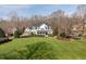 Beautifully landscaped two-story home with a lush green lawn and mature trees at 1412 Wynncrest Ct, Raleigh, NC 27603