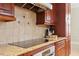 Kitchen with granite countertops, stainless steel appliances, and tile backsplash at 1412 Wynncrest Ct, Raleigh, NC 27603