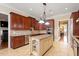 Gourmet kitchen with custom cabinets, granite countertops, and stainless steel appliances at 1412 Wynncrest Ct, Raleigh, NC 27603