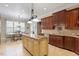 Bright kitchen with an island, granite countertops, and stainless steel appliances at 1412 Wynncrest Ct, Raleigh, NC 27603