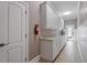 Laundry room with white cabinets, sink and countertop and a fire extinguisher at 1412 Wynncrest Ct, Raleigh, NC 27603