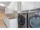 Laundry room featuring countertop space, sink, and new washer and dryer at 1412 Wynncrest Ct, Raleigh, NC 27603