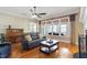 Inviting living room featuring a large window and comfortable seating at 1412 Wynncrest Ct, Raleigh, NC 27603