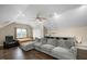 Bedroom featuring hardwood floors, recessed lighting and large sectional sofa at 1701 Point Owoods Ct, Raleigh, NC 27604