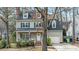 Classic two-story home featuring blue shutters, dormer windows and mature trees at 1701 Point Owoods Ct, Raleigh, NC 27604