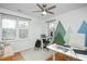 Home office space with natural light, multiple desks and a decorative accent wall at 1701 Point Owoods Ct, Raleigh, NC 27604