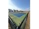 Community pickleball courts with fence and neighborhood homes in the background at 184 Bruce Dr, Dunn, NC 28334