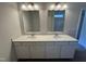 Bathroom with double sink vanity, providing ample space and storage, well lit with vanity lighting at 184 Bruce Dr, Dunn, NC 28334