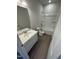 Bathroom featuring a single vanity and tub-shower combo at 184 Bruce Dr, Dunn, NC 28334