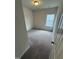 Bedroom with neutral carpet and a window at 184 Bruce Dr, Dunn, NC 28334