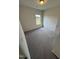 This bedroom features a window, plush carpet, and neutral paint and ample space at 184 Bruce Dr, Dunn, NC 28334