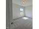 Bedroom featuring neutral carpet, natural light, and a double-door closet at 184 Bruce Dr, Dunn, NC 28334