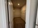 Large walk-in closet with wire shelving and wood-look flooring at 184 Bruce Dr, Dunn, NC 28334