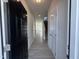 View of the entryway with a black front door and light gray wood-look flooring at 184 Bruce Dr, Dunn, NC 28334