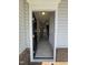 View of the light and airy entryway with light wood floors and a black front door at 184 Bruce Dr, Dunn, NC 28334