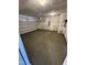 An empty, two car garage space with sealed concrete flooring at 184 Bruce Dr, Dunn, NC 28334