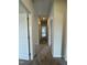 Hallway with neutral walls and carpet leading to bedrooms at 184 Bruce Dr, Dunn, NC 28334