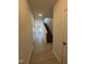 Hallway view featuring wood floors, a staircase, and access to other rooms at 184 Bruce Dr, Dunn, NC 28334
