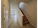 Hallway view with a staircase and light gray wood-look flooring at 184 Bruce Dr, Dunn, NC 28334
