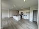Kitchen area with a large granite island, recessed lighting, and stainless appliances at 184 Bruce Dr, Dunn, NC 28334