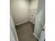 Tiled laundry room featuring a wire shelf and utility hookup at 184 Bruce Dr, Dunn, NC 28334