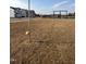 Community playground with swings and playset in a lawn area at 184 Bruce Dr, Dunn, NC 28334