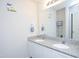 Bathroom featuring a granite countertop double vanity, neutral walls, and modern fixtures at 2121 Wildwind Dr, Graham, NC 27253
