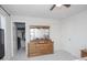 Bedroom featuring closet and dresser with mirror, neutral walls and carpet, and ceiling fan at 2121 Wildwind Dr, Graham, NC 27253