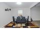 Cozy dining room featuring a sleek table with seating for six and modern decor at 2121 Wildwind Dr, Graham, NC 27253