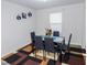 Inviting dining room featuring a table with seating for six, a window, and stylish wall decor at 2121 Wildwind Dr, Graham, NC 27253