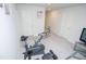 Finished exercise room features neutral walls and carpet, with an exercise bike and glass console at 2121 Wildwind Dr, Graham, NC 27253