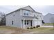 Attractive home showcasing a two-car garage, a covered entry, and well-kept landscaping at 2121 Wildwind Dr, Graham, NC 27253