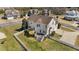 A sprawling fenced backyard features lush greenery, a wooden deck, and convenient access to the attached garage at 22 Old York Cir, Clayton, NC 27527