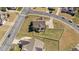 Aerial view of a home featuring a spacious fenced backyard, driveway, and lush green surroundings at 22 Old York Cir, Clayton, NC 27527