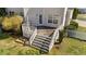 Elevated wooden deck with stairs, ideal for outdoor dining and entertaining at 22 Old York Cir, Clayton, NC 27527