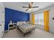 Fun bedroom with blue accent wall with stars and yellow curtains at 22 Old York Cir, Clayton, NC 27527