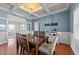 Elegant dining room boasts coffered ceilings, a modern chandelier, and seating for six, ideal for entertaining guests at 22 Old York Cir, Clayton, NC 27527