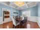 Spacious dining room featuring coffered ceilings, chandelier, and ample natural light flowing from an adjacent room at 22 Old York Cir, Clayton, NC 27527