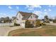 Charming two-story home with a well-manicured front yard, paved driveway, and attached garage at 22 Old York Cir, Clayton, NC 27527