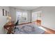 Sunlit home office with hardwood floors, a desk, and a comfortable chair, perfect for productive work from home at 22 Old York Cir, Clayton, NC 27527