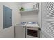 Functional laundry room with modern washer and dryer, and ample storage space, making laundry days a breeze at 22 Old York Cir, Clayton, NC 27527