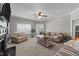 Inviting living room features neutral colors, cozy seating, a ceiling fan, and a coffee table, perfect for casual gatherings at 22 Old York Cir, Clayton, NC 27527