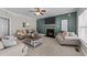 Cozy living room featuring a fireplace, ceiling fan and comfortable seating arrangement, perfect for relaxation at 22 Old York Cir, Clayton, NC 27527
