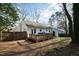 Exterior shot of the backyard with a deck and fenced-in yard, offering privacy and space for outdoor living at 224 Round About Rd, Holly Springs, NC 27540