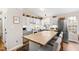 Bright eat-in kitchen featuring white cabinets, stainless appliances, and butcher block island at 224 Round About Rd, Holly Springs, NC 27540