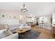 Bright, open-concept living space seamlessly connects the living room, kitchen, and dining area at 224 Round About Rd, Holly Springs, NC 27540