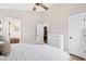 Comfortable main bedroom showcasing a bed, dresser, and neutral tones at 224 Round About Rd, Holly Springs, NC 27540