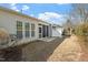 The backyard features a screened-in porch, a patio, and a lawn at 241 Lifeson Way, Cary, NC 27519